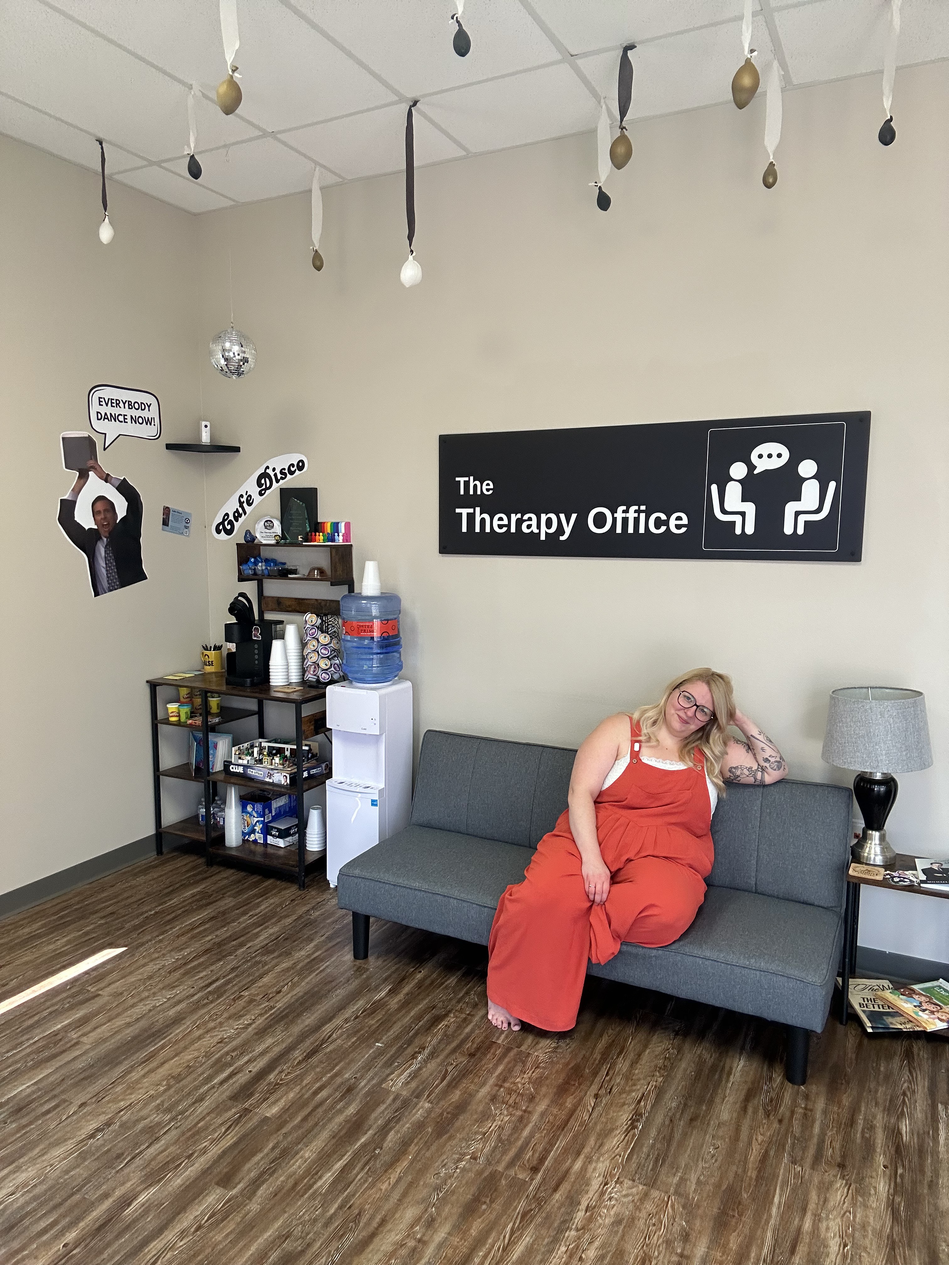 Becca Ferguson, LPC hanging up a sign on her front door